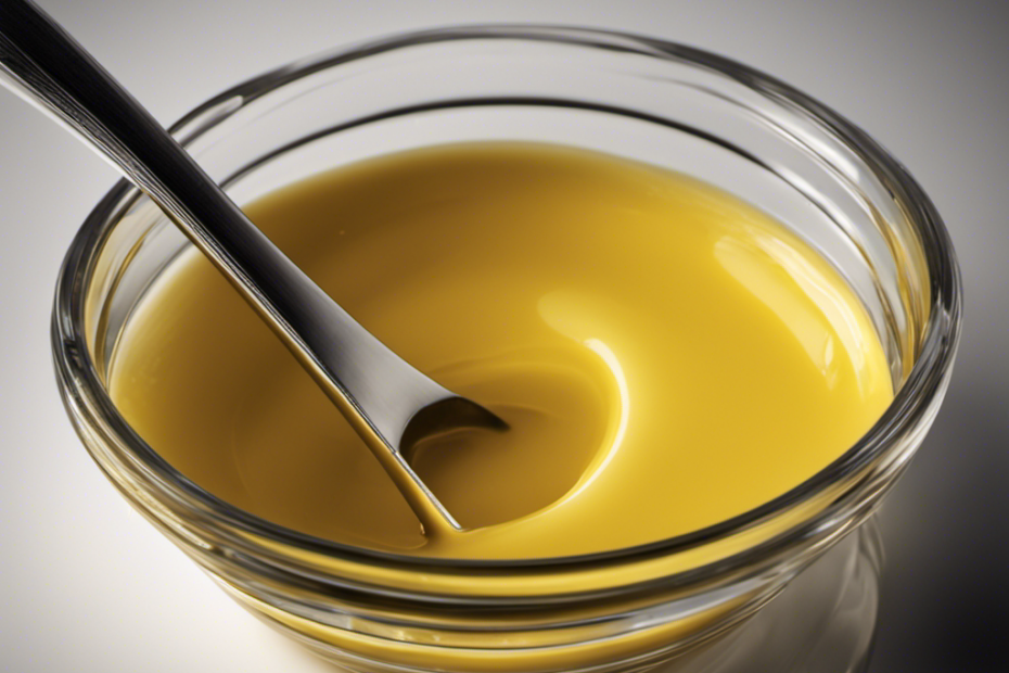 An image showing a measuring cup filled with exactly 1/3 cup of melted butter