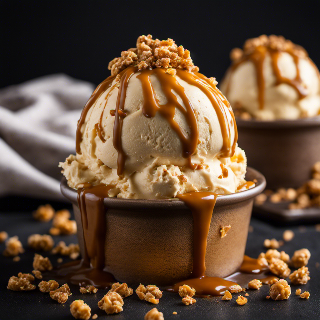 An image that captures the lusciousness of butter crunch ice cream: a creamy scoop of velvety golden ice cream, generously studded with crunchy toffee bits, glistening under a drizzle of rich caramel sauce