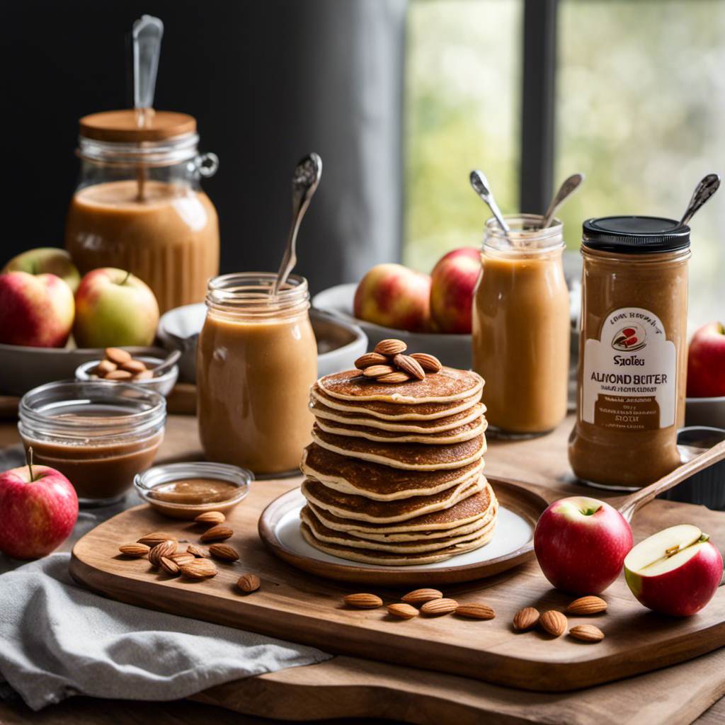 An image that showcases the versatility of almond butter, depicting a wooden cutting board with a variety of delectable treats: a stack of almond butter pancakes, an apple slice dipped in almond butter, and a spoonful of almond butter swirled into a smoothie