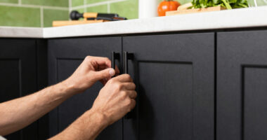 Black, Bold Cabinets and Dramatic Green Tiles Refresh This 2000s Kitchen
